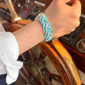 Pilot of the Pearl wearing our nautical sailor bracelet in her favorite white and turquoise